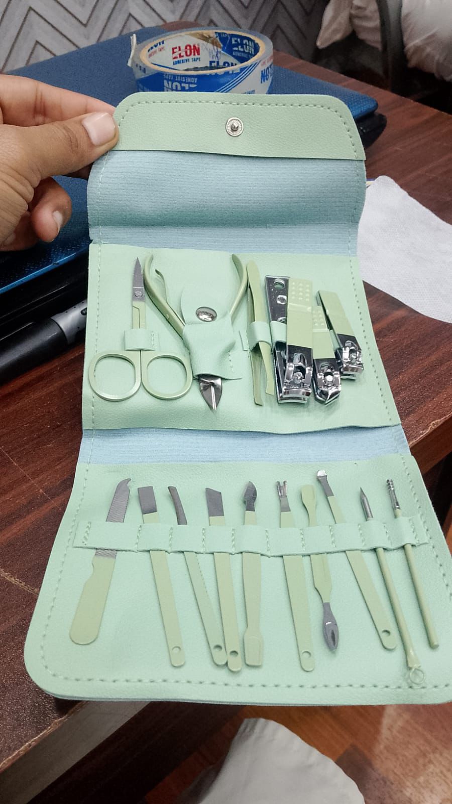 16-in-1 Household Manicure Set – Stainless steel nail grooming tools including clippers, scissors, and ear spoon (Color May Vary).